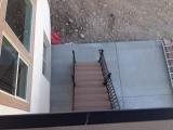 View form the Deck looking down on stairs to concrete pad