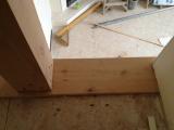 Looking down from end run of banister on top floor