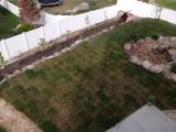 Looking down from top deck to back of garden with fruit trees along the fence
