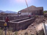 Pouring Cement into Foundation Template and Finishing