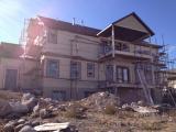 Full view of back of house with window pop-outs painted