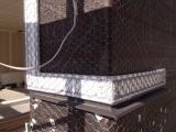 Detail of plastic, chicken wire and cemented staples
