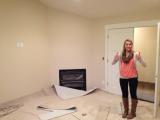 Beth in master bedroom with carpet being laid