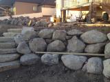 Lower rock wall and building pit