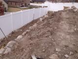 Lower rock wall and building pit