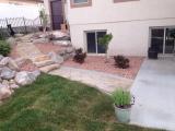 Looking at the pathway up to left side of house where fenced dog section is