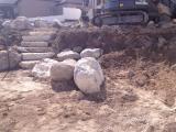 Lower rock wall and building pit