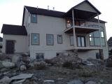 Back of house nearly completed the painting and rock columns are looking good