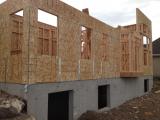 Back of house with bay window in nook