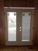 French Doors in Nook with blinds in windows right side closed - these blinds are actually inside the glass.