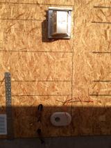 side view of back right of house showing gaspipes