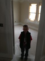 Joshua in door entrance of 2nd bedroom
