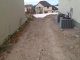 Grading for fencing on front left side of house