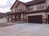Front of house with ground ready for grass