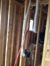 Standing in master toilet looking into master closet with electrics