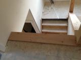 View from top of landing looking down to staircase, half bath below