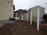Top section of fence posts on back right