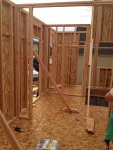 Looking from music room to front door to half bathroom at back