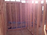 Standing in 2nd bathroom looking through to master bathroom and master shower on right