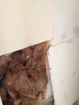 Close up of insulation and sheetrock