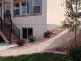 Pathway coming down from left of house viewed from back right of house