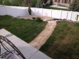 View from lower deck over middle flagstone pathway to fire pit