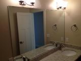 Mirror in place in main bathroom