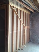 Basement in main area looking at wall behind stairwell