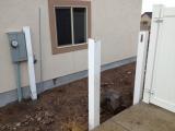 Posts in place on right side behind electric meter