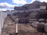 Lower rock wall and building pit