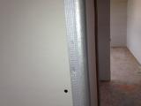 Close up of metal strip covering sheetrock edges