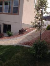 Pathway coming down to corner of house