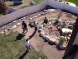 Laying grass around the water feature