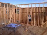 Standing in master bedroom looking through framing to vaulted ceiling