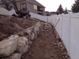 Lower rock wall and building pit