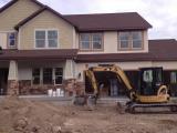 Digger ready to grade the front landscape