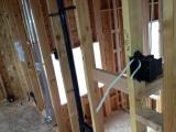 Standing in laundry room view plumbing and electrics