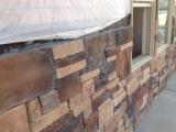 Stone rock on front of house in front of music room