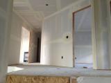 Top of stairs looking upstairs hallway with 2nd bedroom on right and master on left