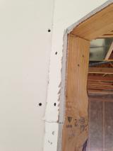 Sheetrock - Second bedroom close up of sheetrock assembly onto timber