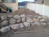 Rock wall at back of fire pit