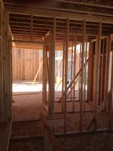 Standing in office viewing hallway to lounge with mud room and pantry on right