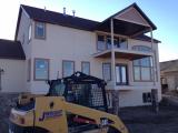 Back of house painted and rock columns in place