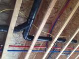Plumbing under master bedroom viewed from basement