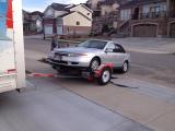 Beth and Tanner home with truck and car from Idaho, the concrete looks good!