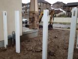 Posts set for front left with gate in center, viewed from back right