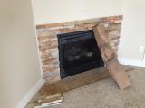 Master bedroom fireplace nearly completed rock surround