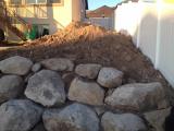 Rock wall at back of fire pit