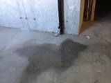 Basement floor under hallway to mud room