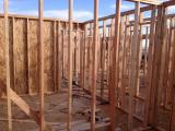 Standing in 4th bedrrom looking into 3rd bedroom with hallway on right